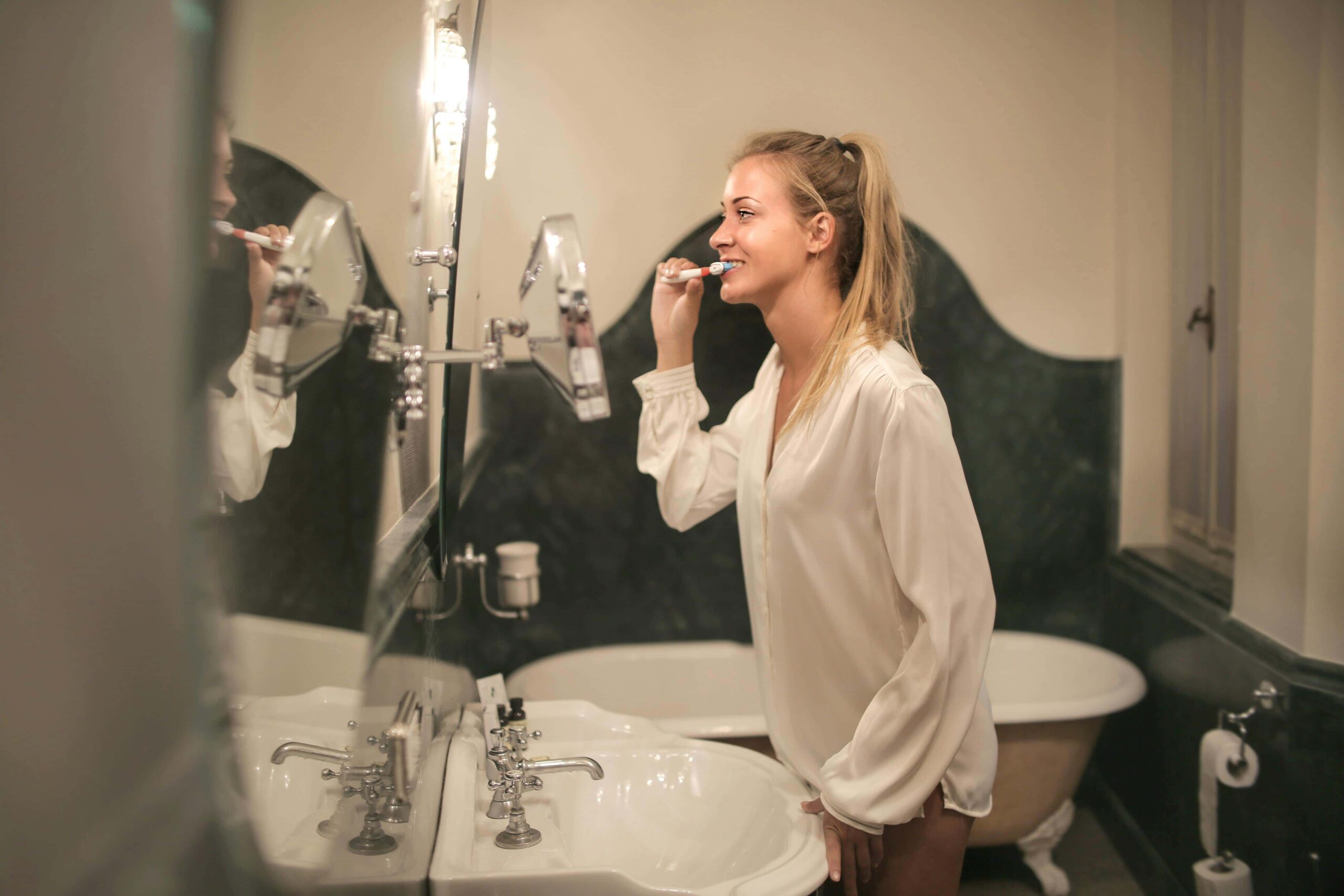 woman brushing teeth